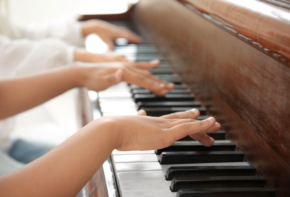 boy playing piano shutterstock 755755306 1