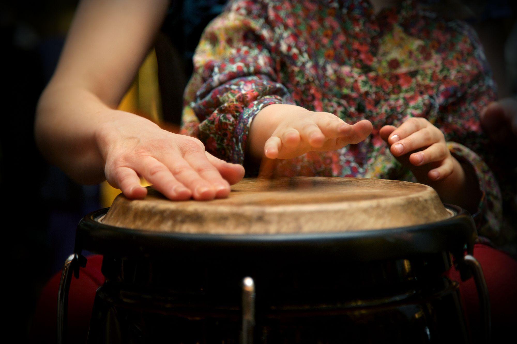 two hands on drum