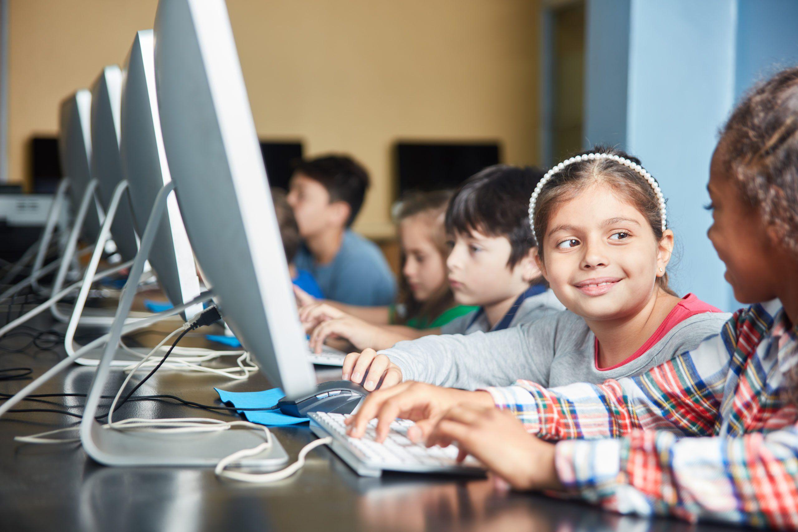Children-with-computers-shutterstock_1493975735-scaled.jpg