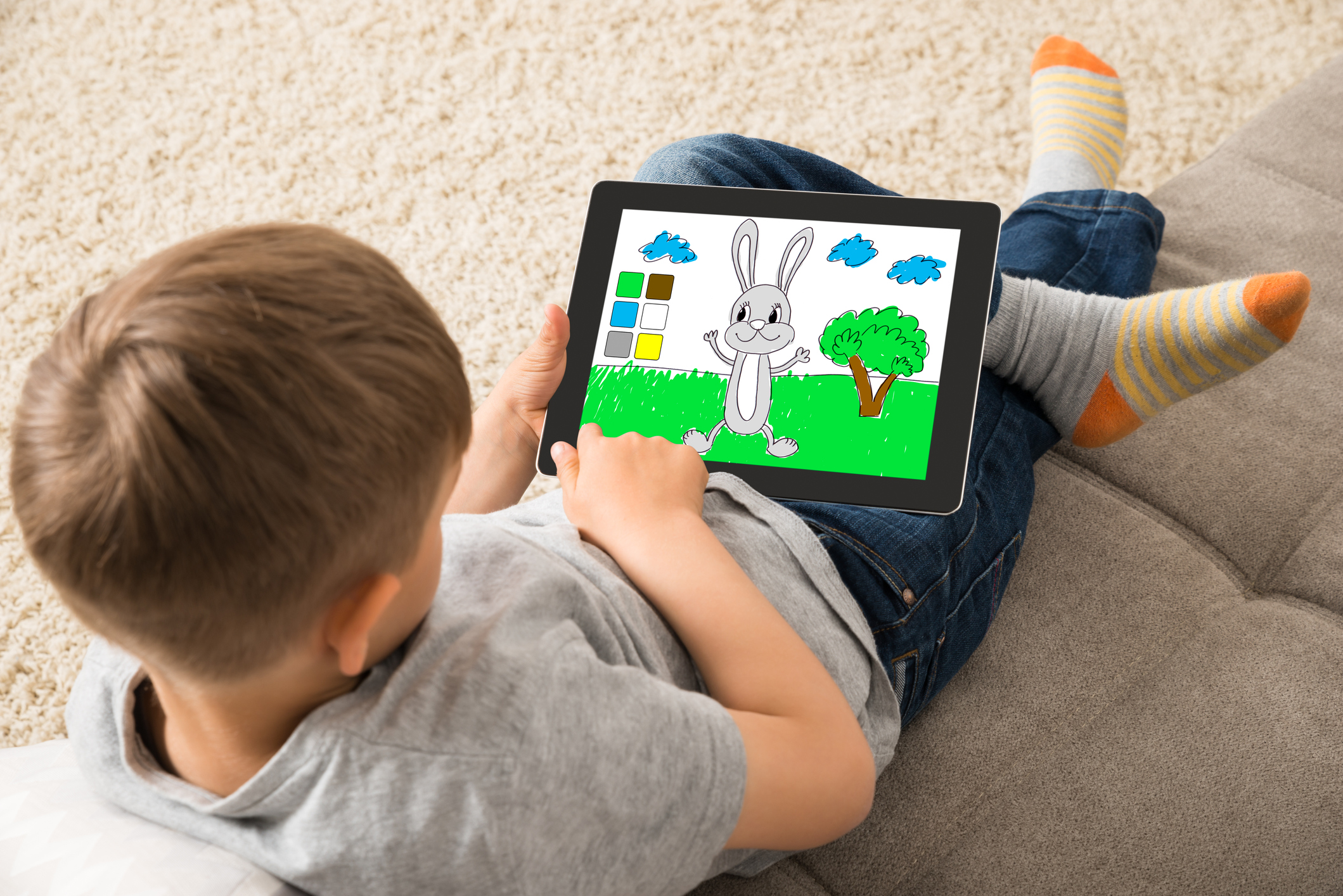 young boy on a tablet