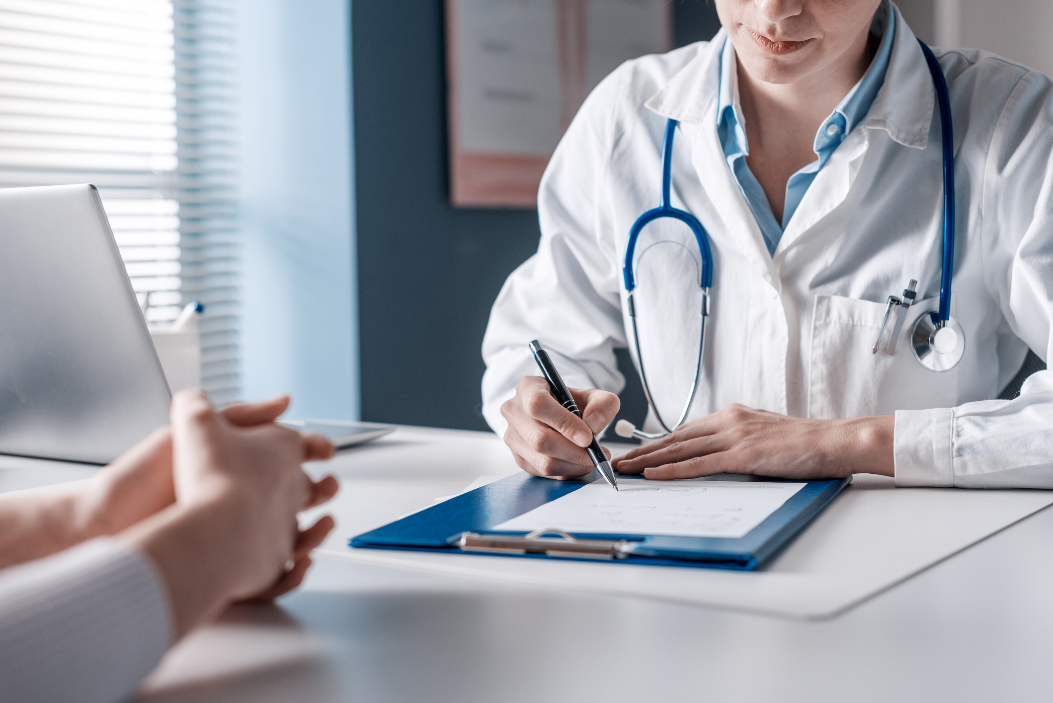 Doctor consulting with patient