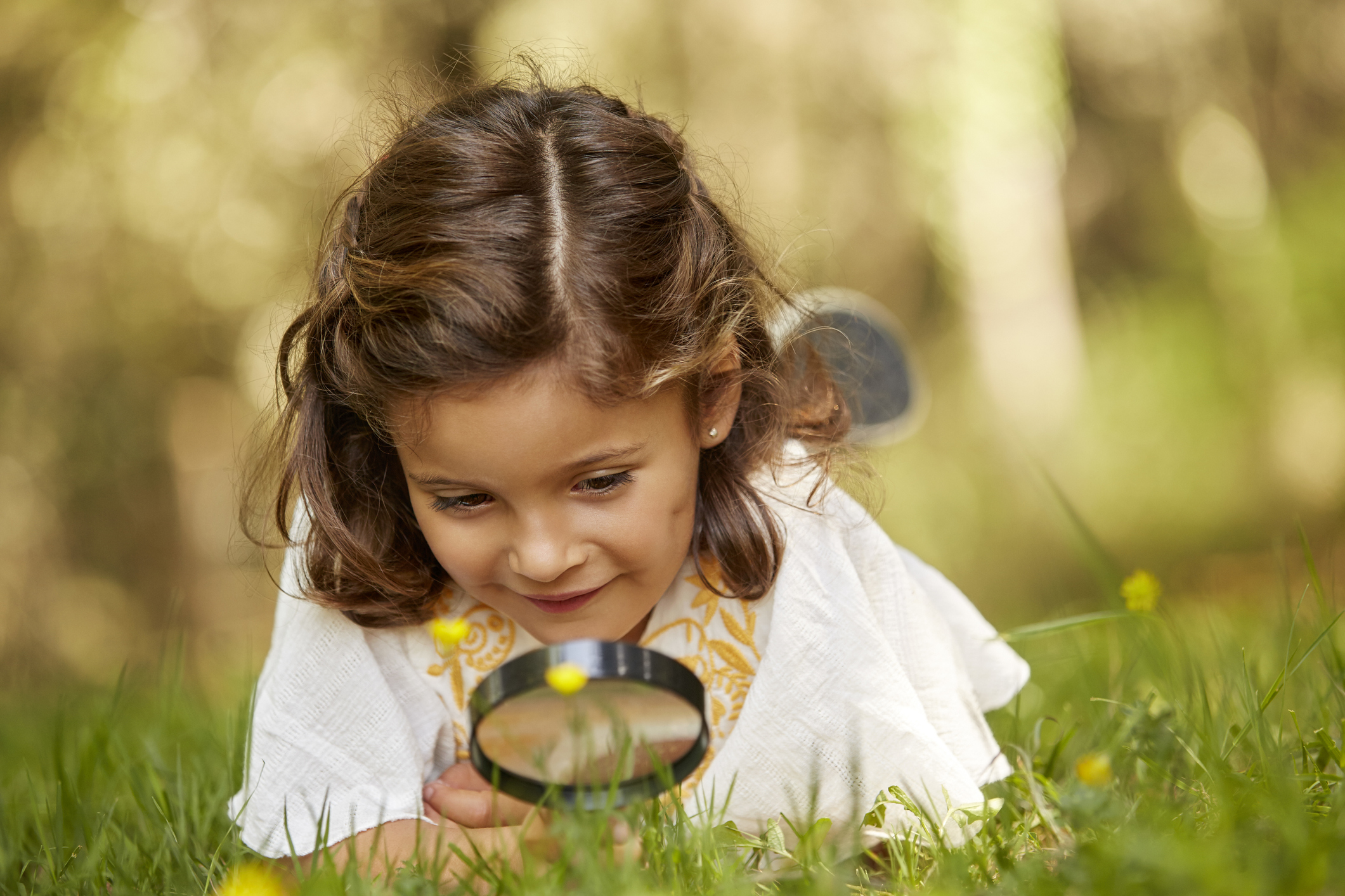 girl with magnifying glass