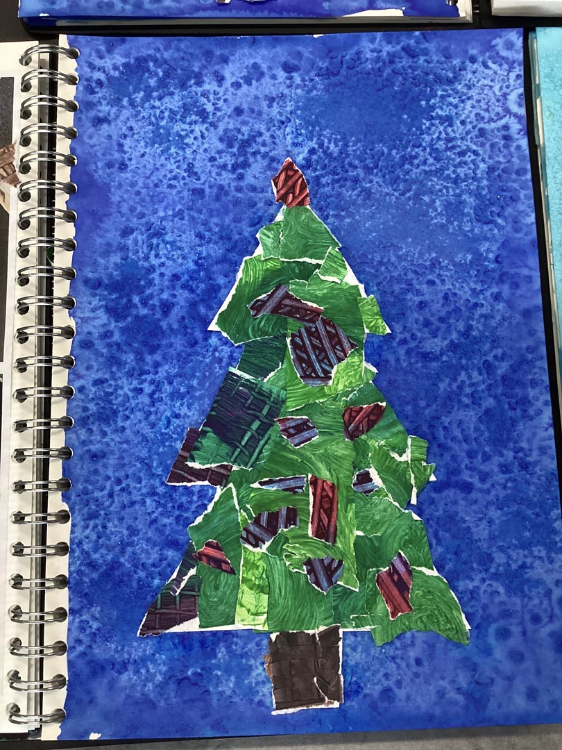 Christmas tree collage on a blue painted background